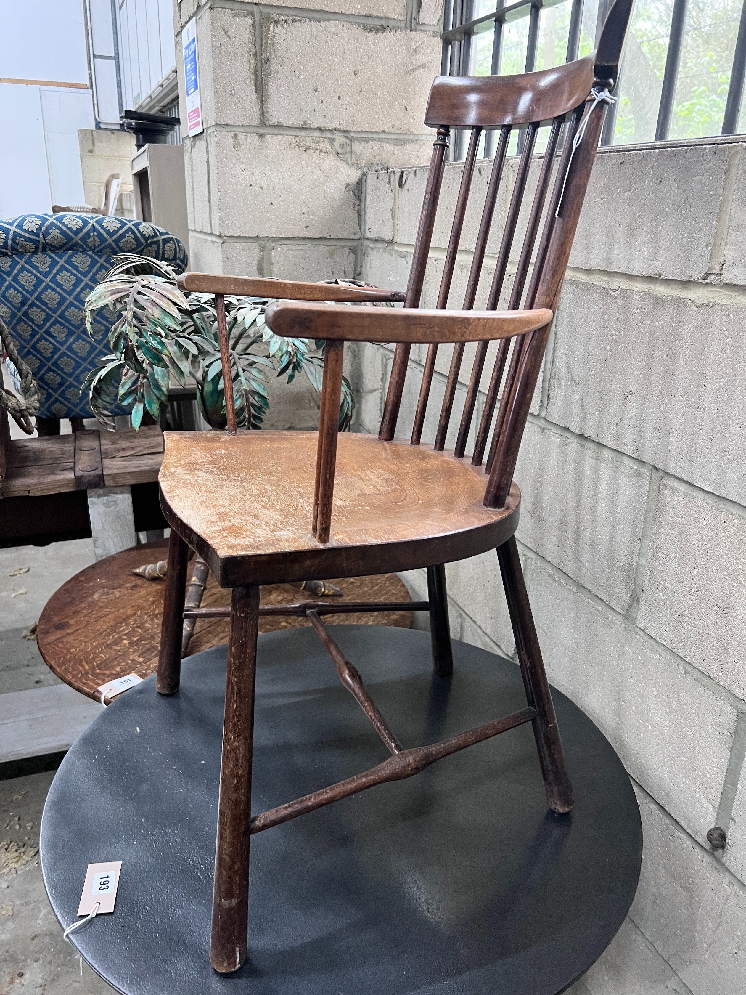 An Arts & Crafts beech Windsor comb back elbow chair, width 49cm, depth 41cm, height 86cm *Please note the sale commences at 9am.